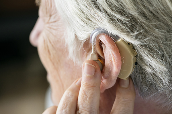 image of patient with hearing aid